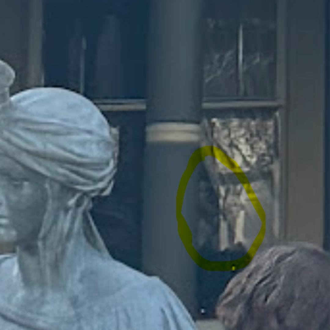 This photo was shared by Janelle R. from California, who believes she sees a man's face wearing a top hat in the window.